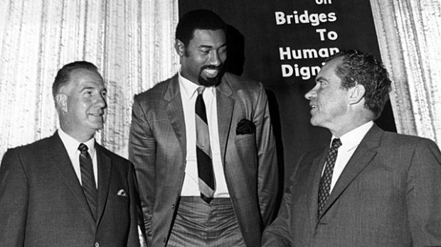 Wilt Chamberlain poses with United States president Richard Nixon with and Maryland governor Spiro T. Agnew during an event August 17, 1968 in Mission Bay, California.