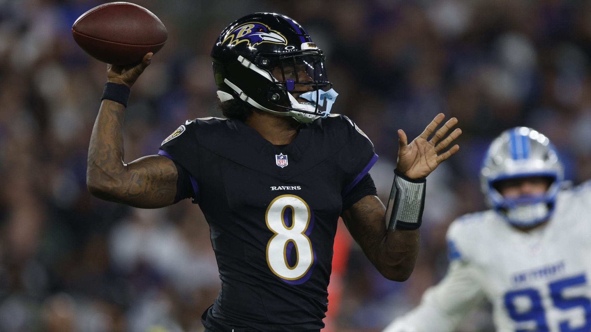 Lamar Jackson drops back to pass