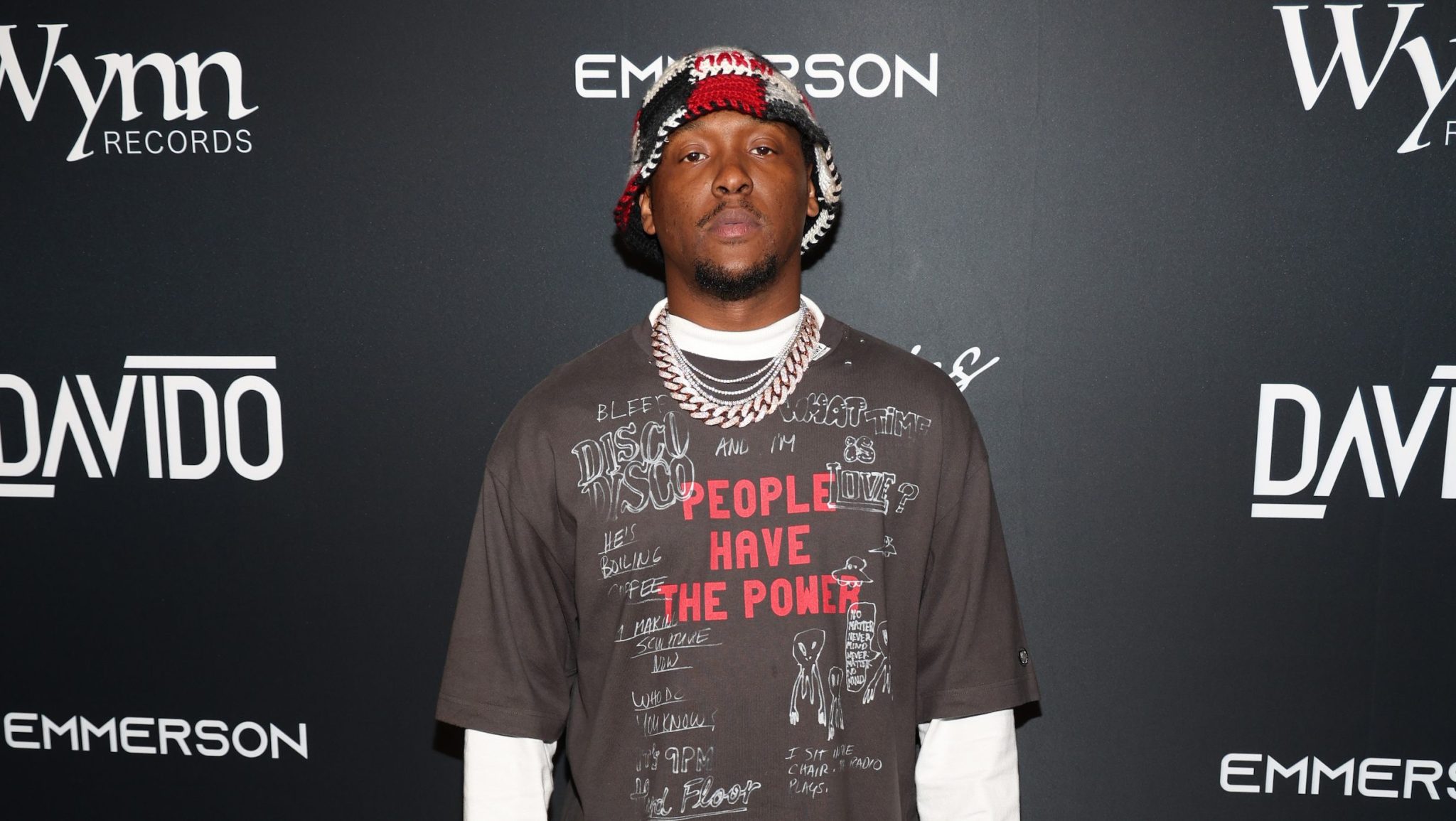 Producer Hit Boy poses for a picture on the red carpet.