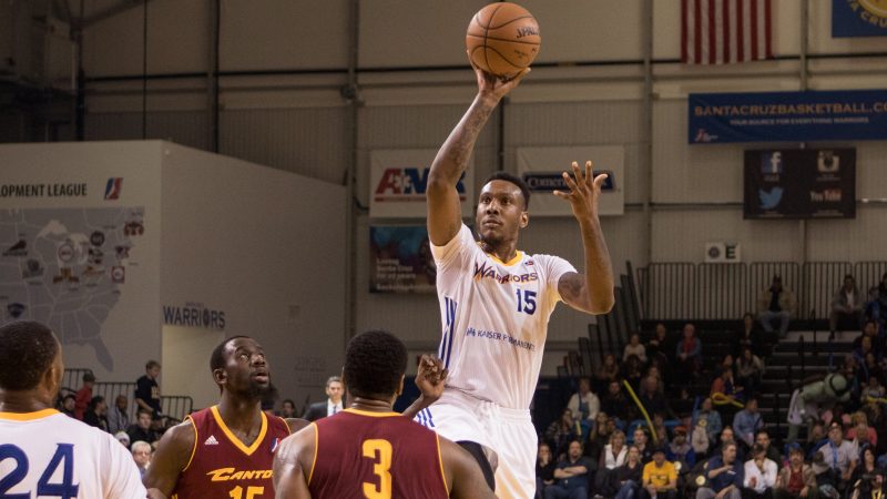 Jarred Shaw of the Santa Cruz Warriors skies over two defenders to shoot the ball