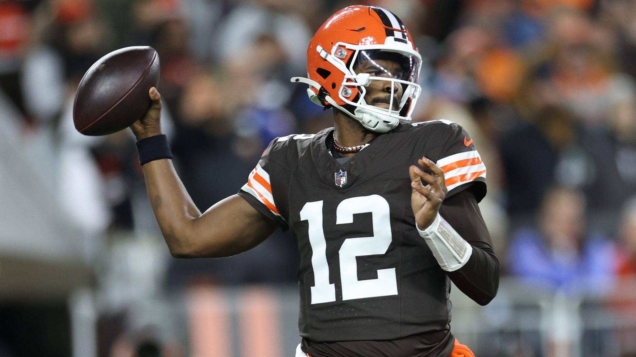 Shedeur Sanders steps up and throws the ball.