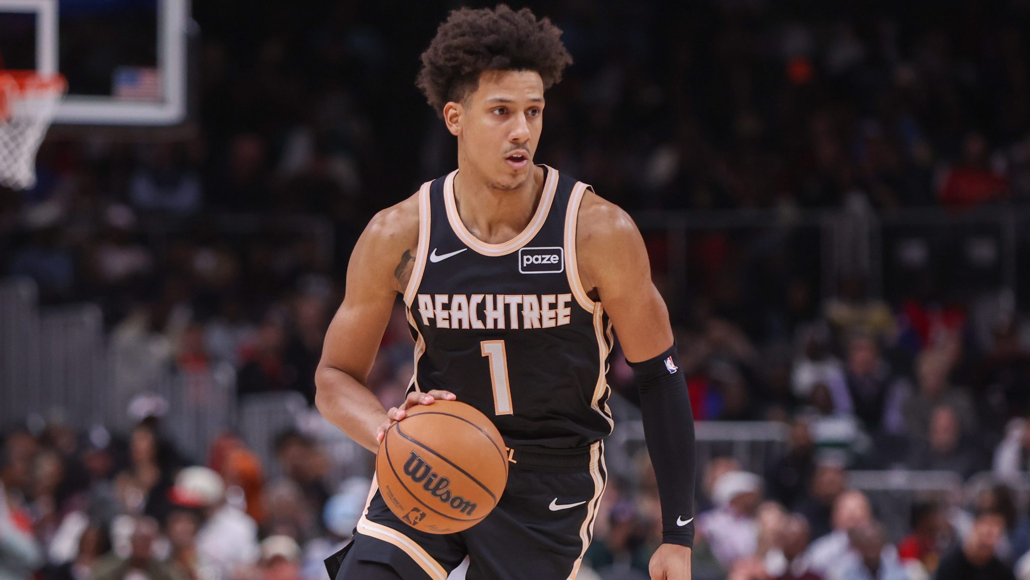 Jalen Johnson dribbles the ball during a game