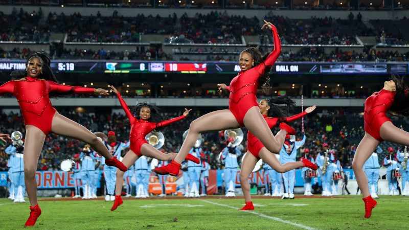 Dancers with the Delaware State Approaching Storm Marching Band perform during halftime