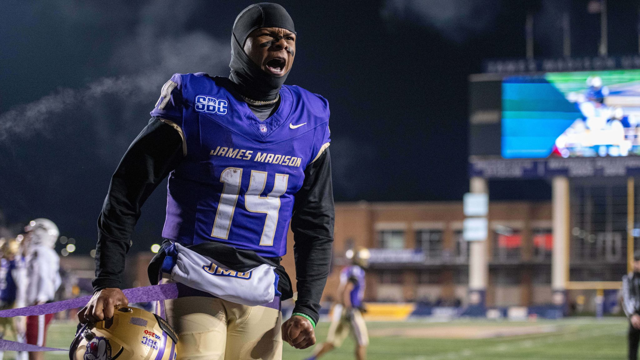 James Madison quarterback Alonza Barnett celebrates