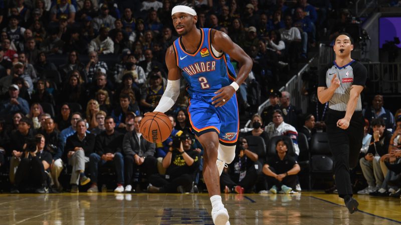 Shai Gilgeous-Alexander dribbles the ball