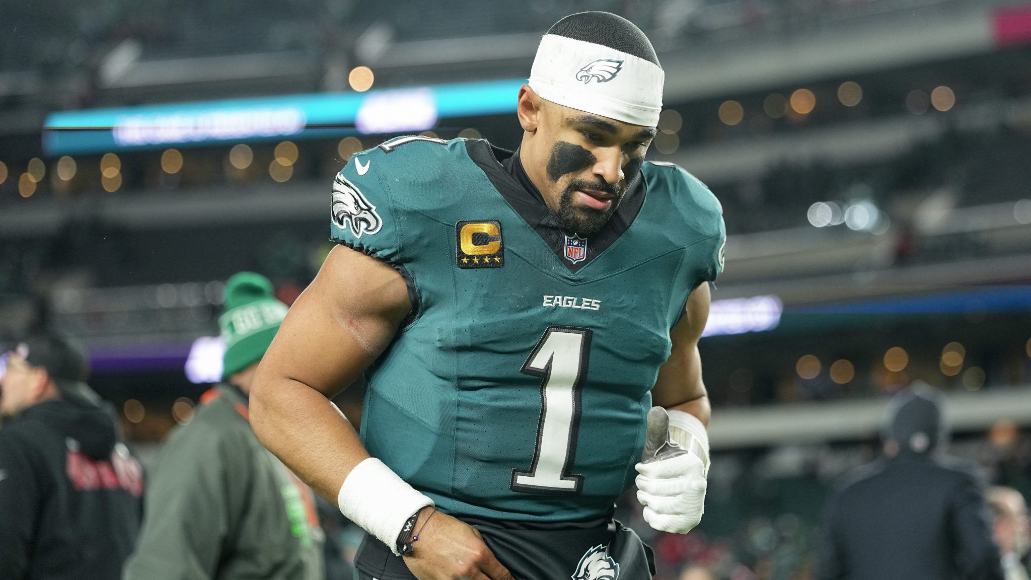 Jalen Hurts jogs off the field