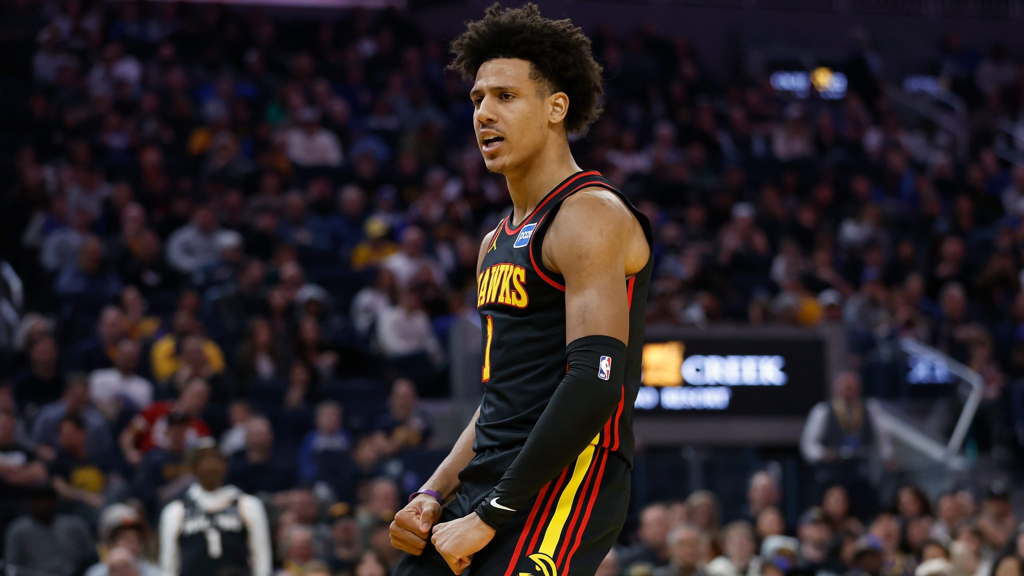 Jalen Johnson reacts after dunking the ball