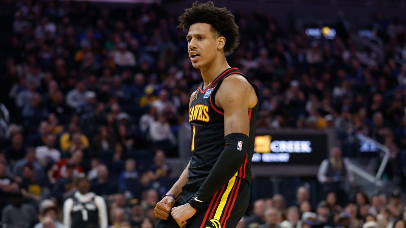 Jalen Johnson reacts after dunking the ball