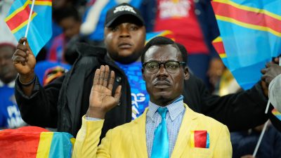 Michel Kuka Mboladinga, a DR Congo fan impersonating late Congolese leader Patrice Lumumba, strikes a pose during the Africa Cup of Nations match
