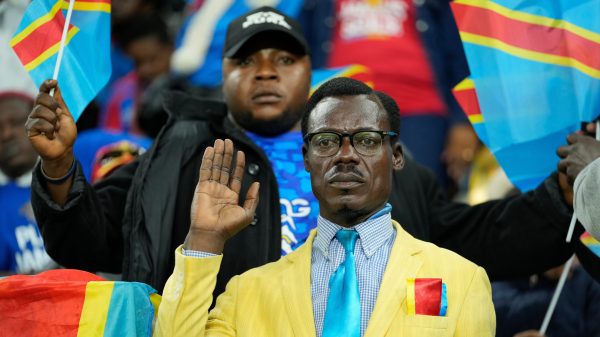 Michel Kuka Mboladinga, a DR Congo fan impersonating late Congolese leader Patrice Lumumba, strikes a pose during the Africa Cup of Nations match