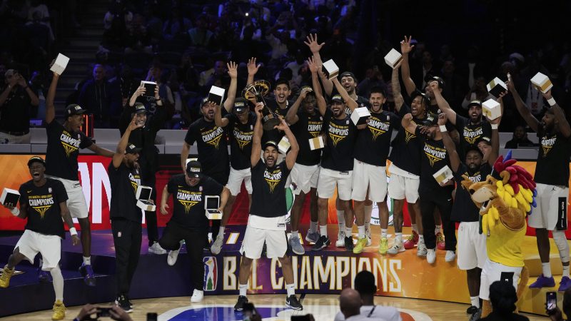 Libya’s Al Ahli Tripoli players celebrate on the court after winning the championship.