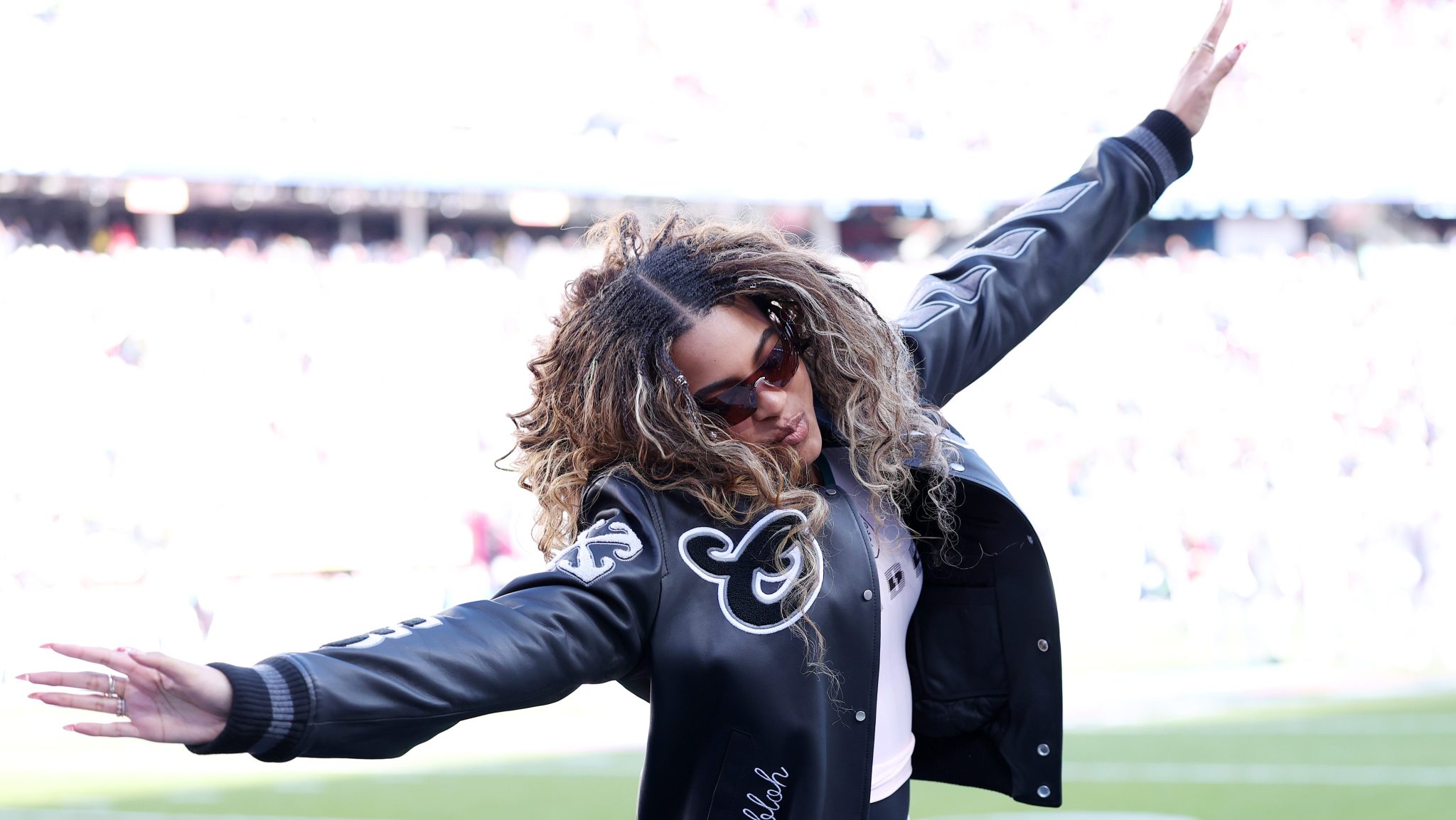 Blue Ivy Carter jumps on the field