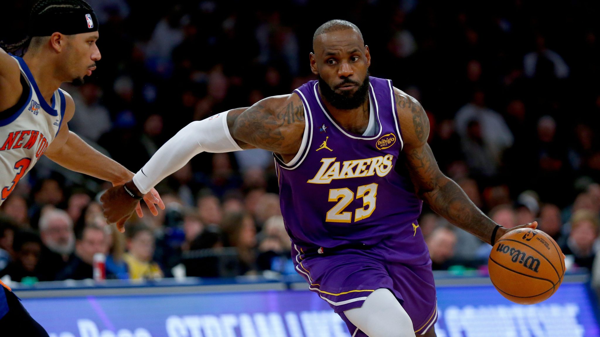 LeBron James drives to the basket.