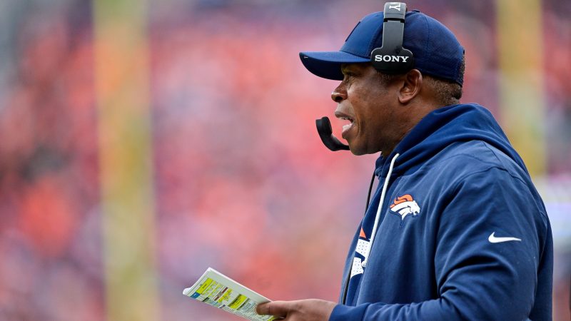 Vance Joseph coaches from the sidelines.