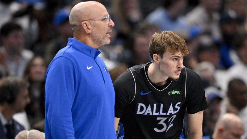 Jason Kidd and Cooper Flagg watch from the sidelines.
