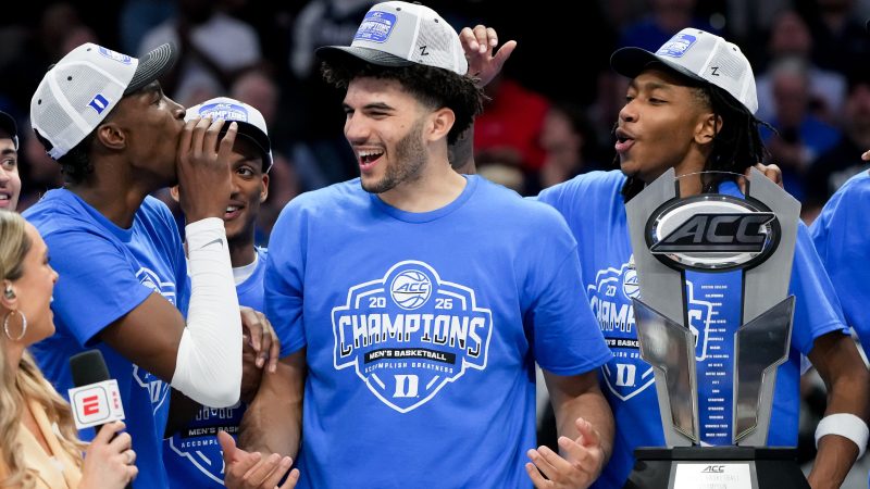 Cameron Boozer smiles with his teammates after winning the ACC tournament.