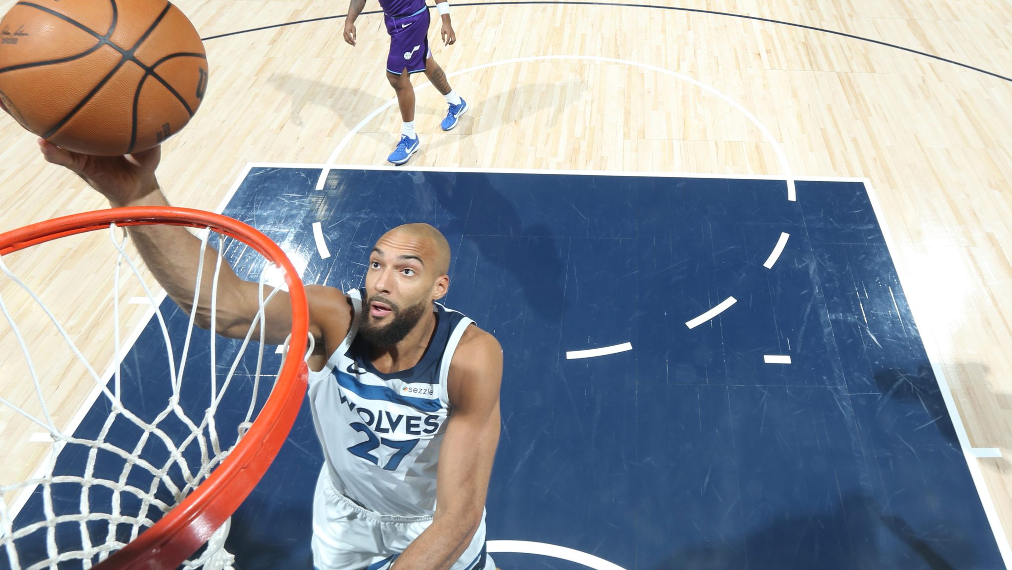 Rudy Gobert drives to the basket for a layup.