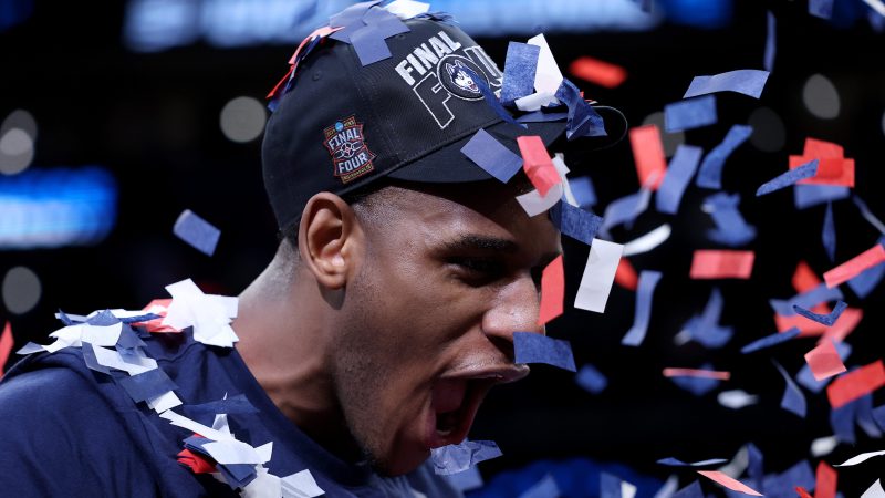 With confetti falling on him, Tarris Reed Jr. celebrates.