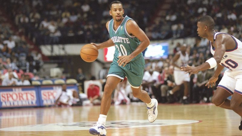 Dell Curry dribbles the ball
