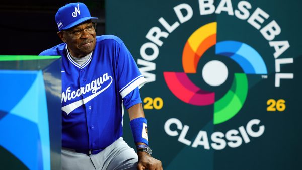 Manager Dusty Baker Jr. of Team Nicaragua stands in the dugout in front of the World Baseball Classic logo.