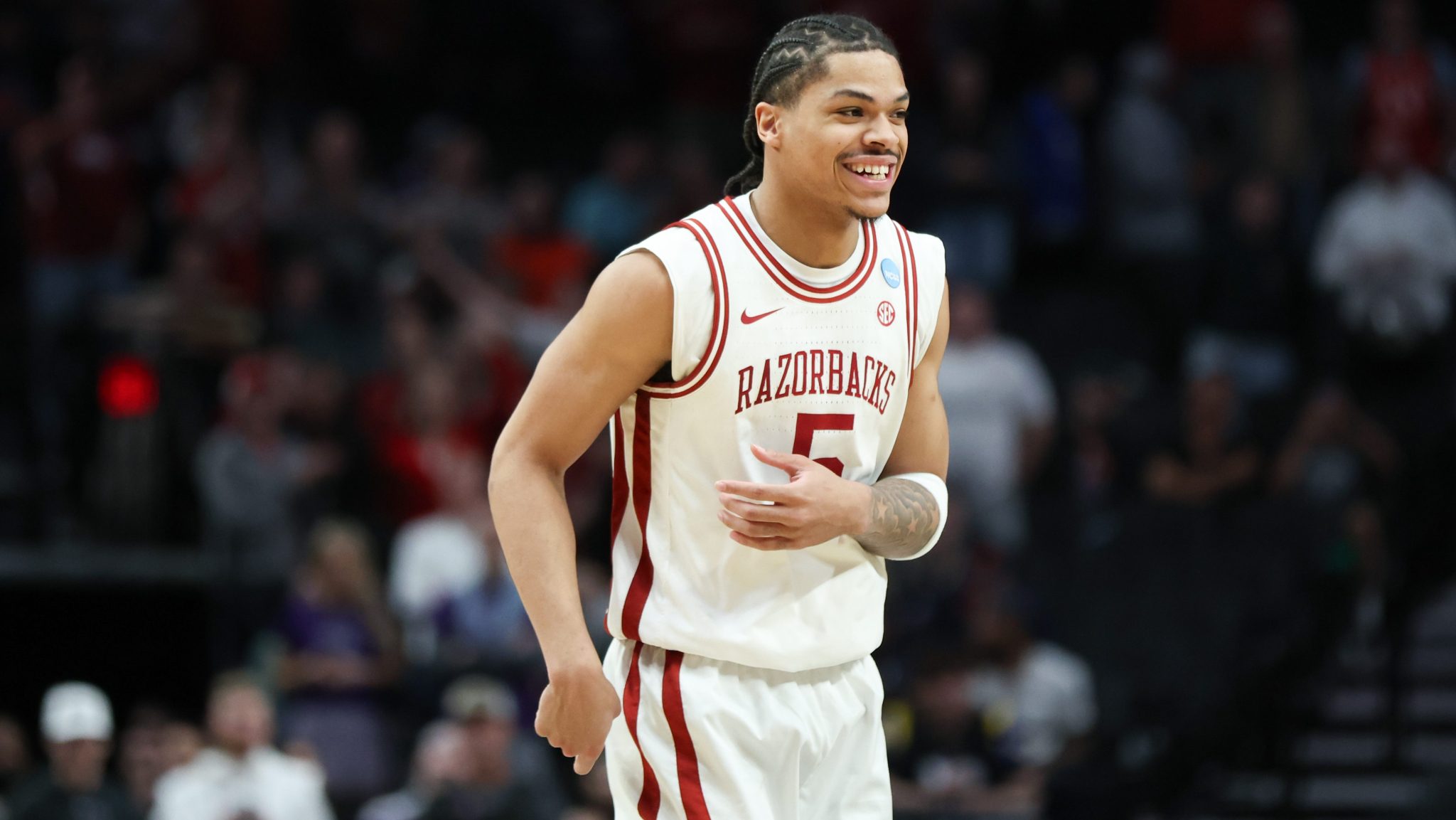 Darius Acuff Jr. smiles on the court