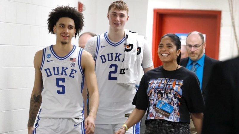 Rachel Baker with Duke players.