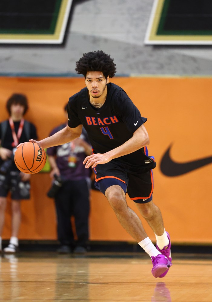 Tyran Stokes dribbles the ball.