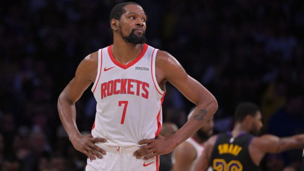 Kevin Durant on the court with his hands on his hips.