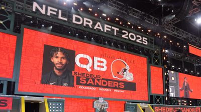 A screen shows Colorado quarterback Shedeur Sanders' name after being selected in the NFL draft
