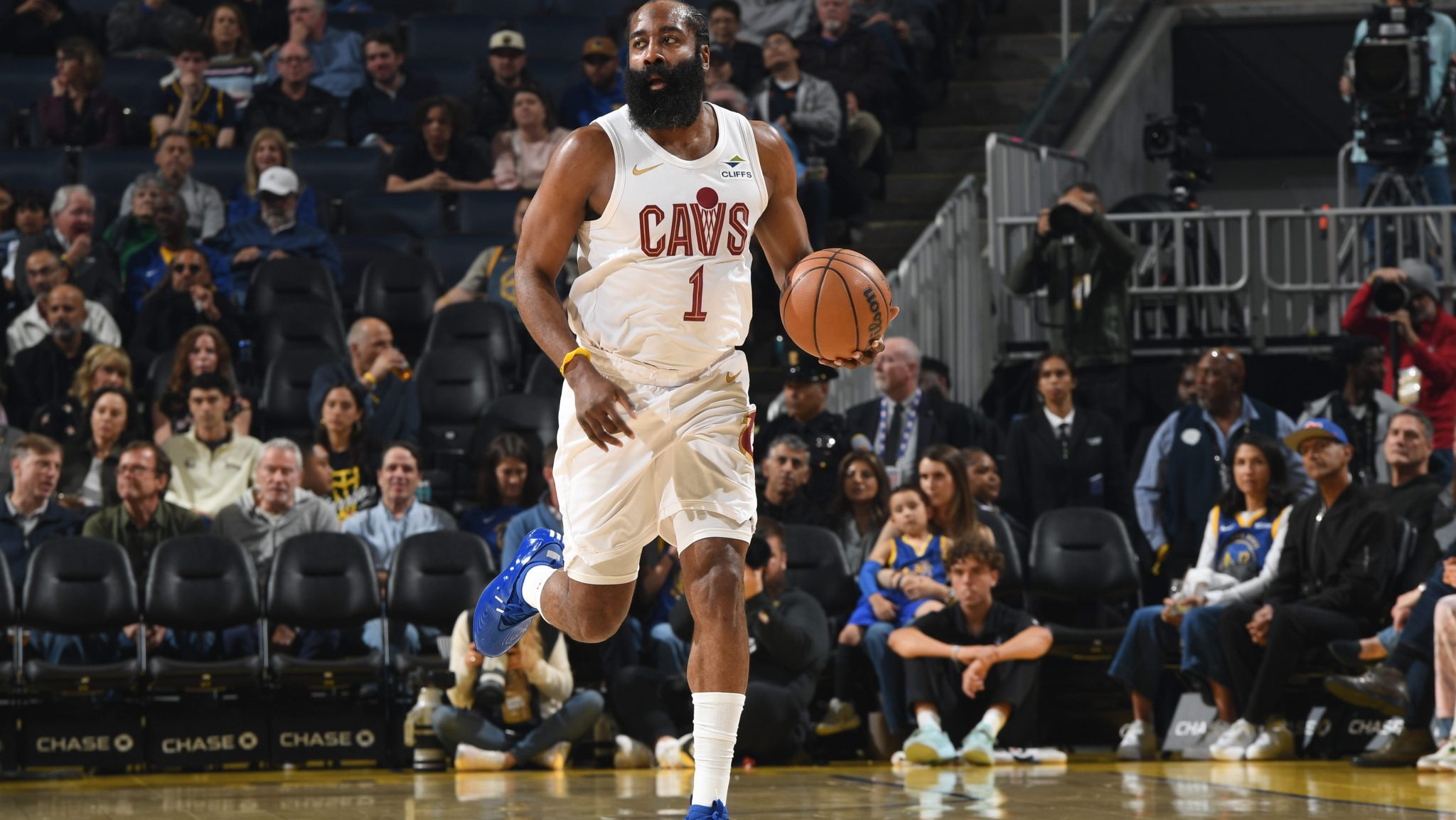 James Harden brings the ball up the court.