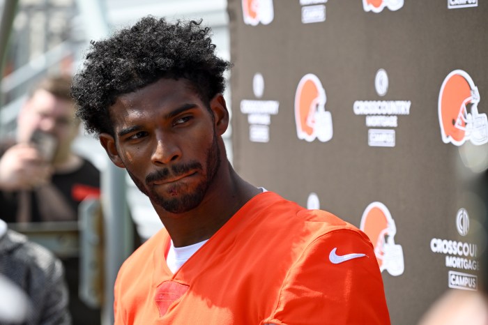 Shedeur Sanders listens to questions from the media