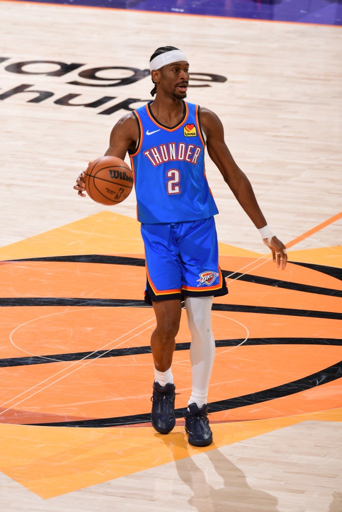 Shai Gilgeous-Alexander brings the ball up the court.