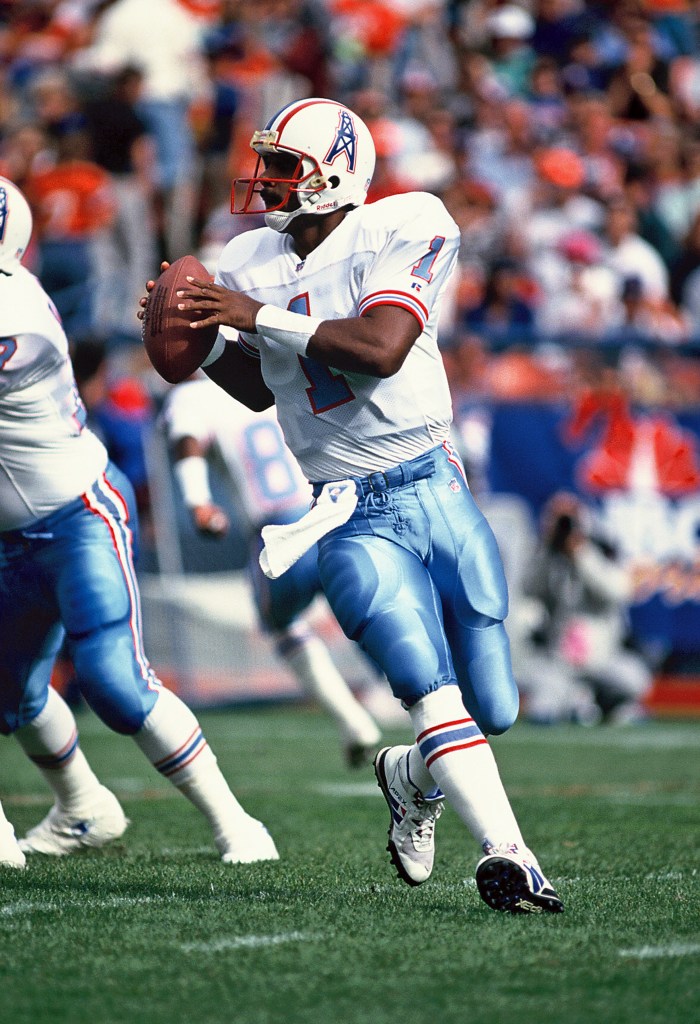 Warren Moon prepares to throw a pass.