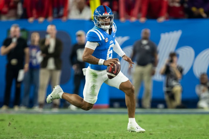 Trinidad Chambliss runs with the ball.