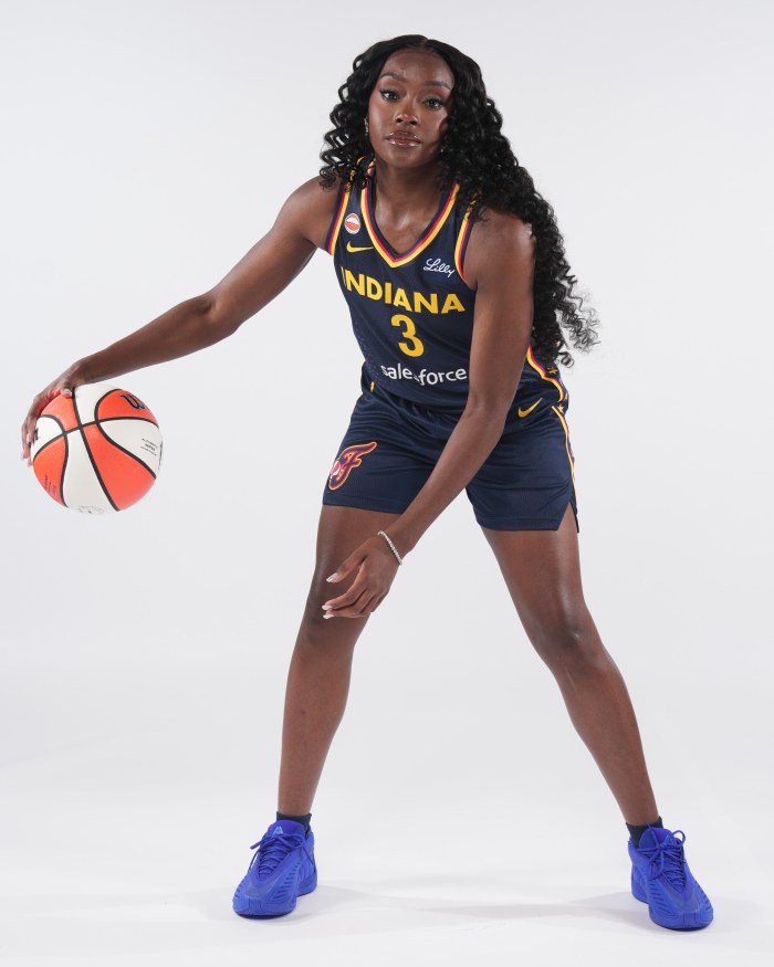 Raven Johnson of the Indiana Fever poses for a portrait during WNBA Media Day on April 22, 2026, at Gainbridge, Fieldhouse in Indianapolis. On her feet were a pair of blue Adidas AE 2s, Anthony Edwards’ signature shoe. 