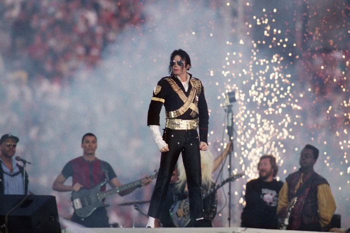 Michael Jackson stands on stage during halftime of a 52-17 Dallas Cowboys win over the Buffalo Bills in Super Bowl XXVII on January 31, 1993 at the Rose Bowl in Pasadena, California. 