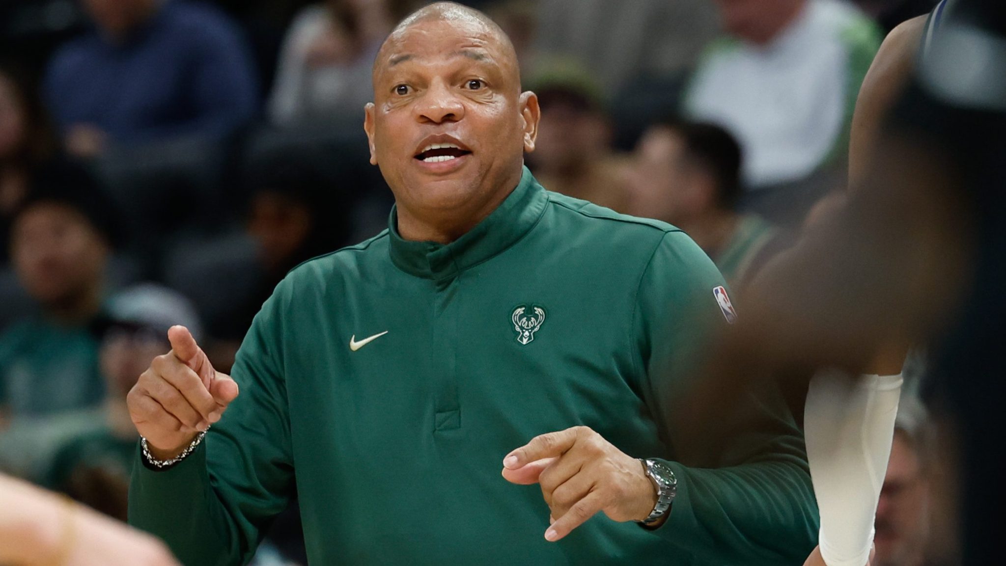 Doc Rivers coaches from the sidelines.