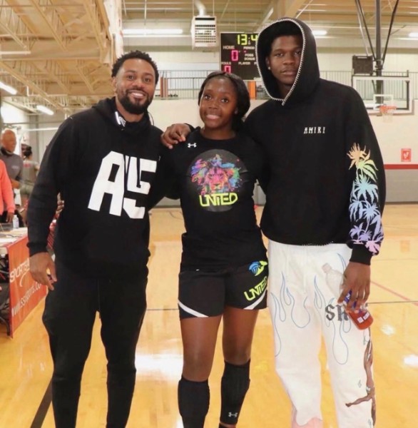 Trainer Justin Holland (from left) worked with Raven Johnson and Anthony Edwards while each player was in high school in Atlanta.