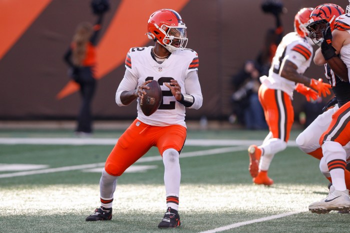 Shedeur Sanders looks to pass during a game
