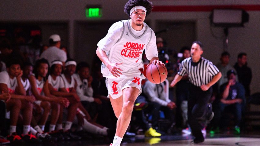 Tyran Stokes brings the ball up the court.