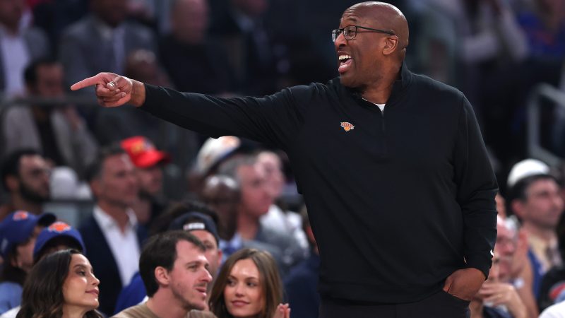 Coach Mike Brown points from the sidelines