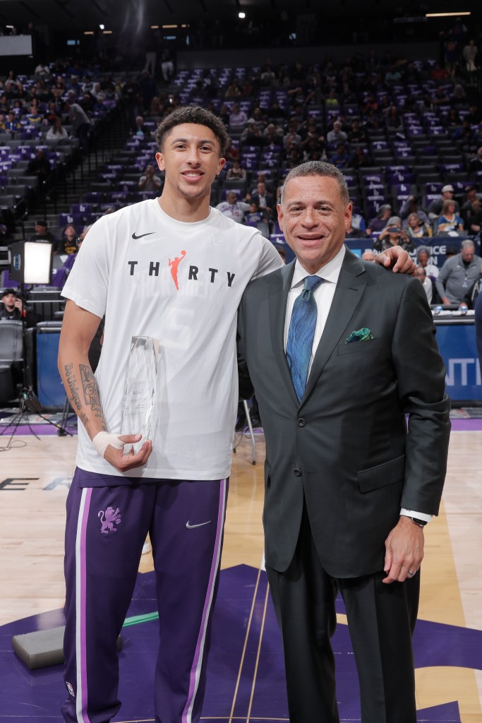 Scott Perry poses for a photo on the court with Nique Clifford
