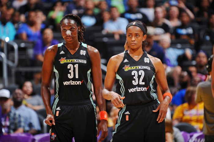 Tina Charles (left) and Swin Cash (right) play during a New York Liberty game against the Los Angeles Sparks on July 3, 2016, at Staples Center in Los Angeles.