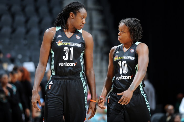Tina Charles (from left) talks with New York Liberty teammate Epiphanny Prince during a game against the San Antonio Stars on Aug. 1, 2017, at the AT&T Center in San Antonio.