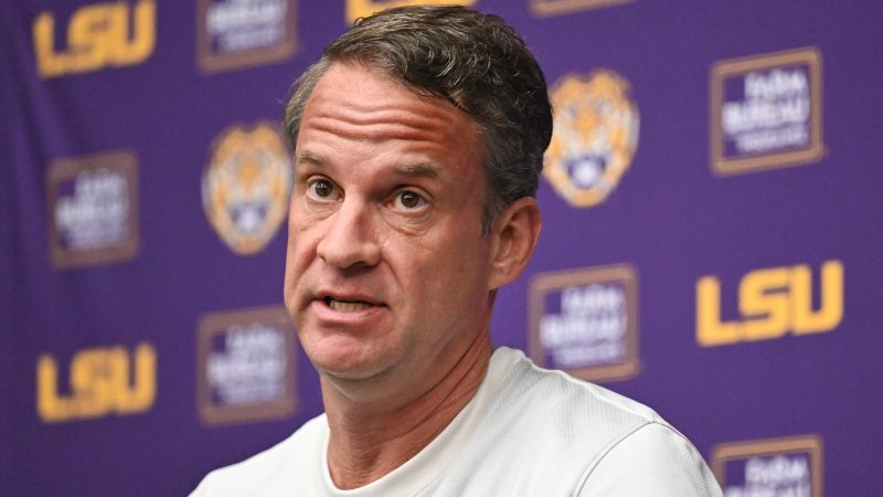 Lane Kiffin talks to the media during an LSU press conference