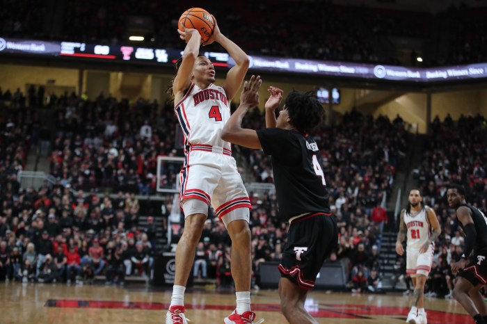 Kingston Flemings shoots over Christian Anderson