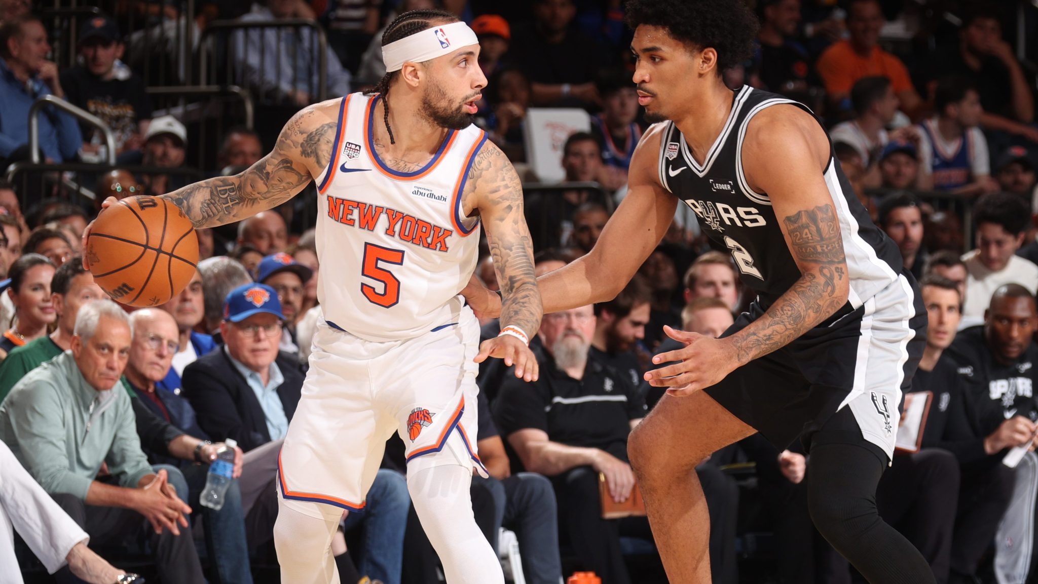 Jose Alvarado is guarded by Dylan Harper