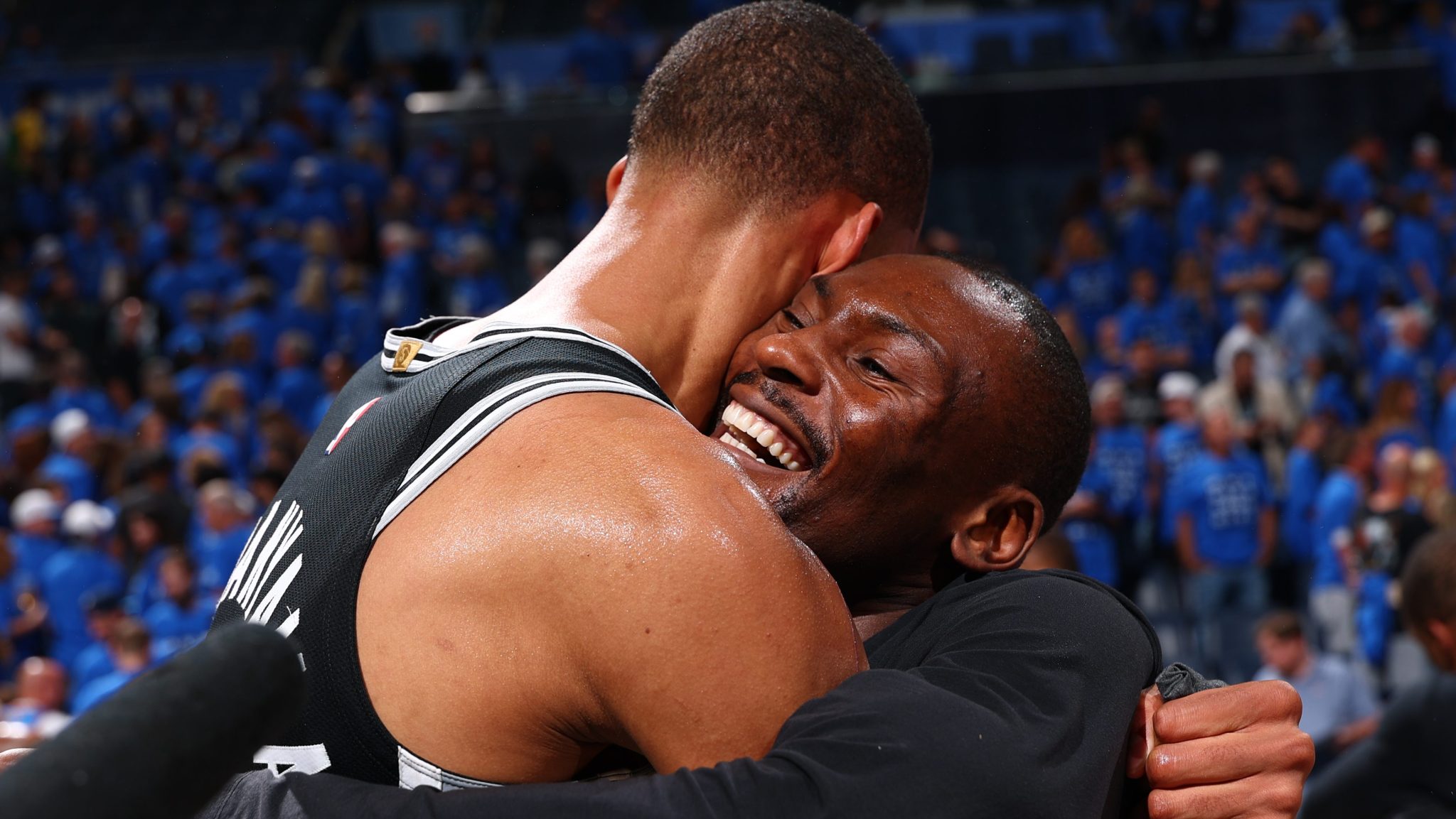 Victor Wembanyama and Bismack Biyombo hug after the game