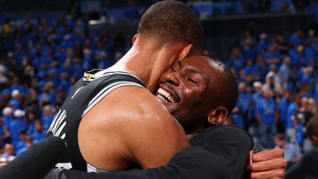 Victor Wembanyama and Bismack Biyombo hug after the game