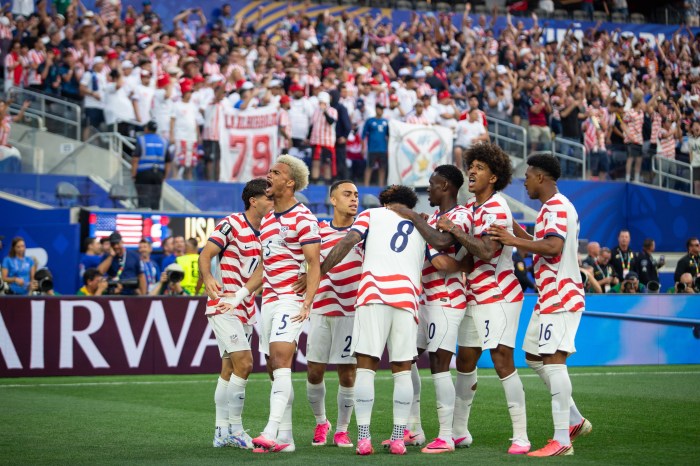 Antonee Robinson and Chris Richards of the United States celebrates a goal with the team 